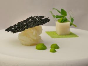a plant sitting next to a piece of food next to a plant at Locanda di Orta in Orta San Giulio +40 photos