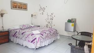 Postel nebo postele na pokoji v ubytování Hotel Las Palmas + 37 fotografií