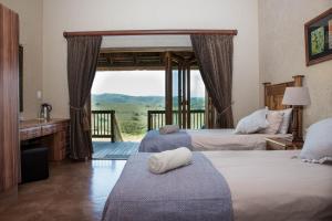 Postel nebo postele na pokoji v ubytování Hartenbos Private Game Lodge + 37 fotografií