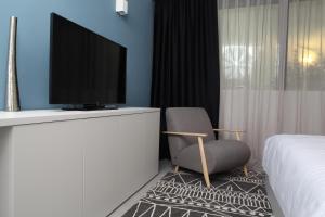 TV a/nebo společenská místnost v ubytování Hotel Cubis