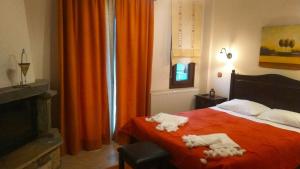 Postel nebo postele na pokoji v ubytování Evilion Traditional Inn