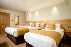 Postel nebo postele na pokoji v ubytování Victoria Hotel