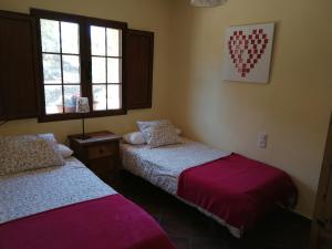 Posteľ alebo postele v izbe v ubytovaní Casa Rural Balcón del Camino Viejo
