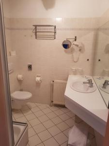 a bathroom with a sink and a toilet at Desperados Hotel in Bergen