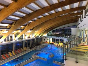 an overhead view of a pool in a hotel at Velence Wellness Apartman in Velence