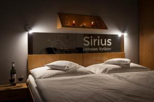 Postel nebo postele na pokoji v ubytování Penzion Sirius
