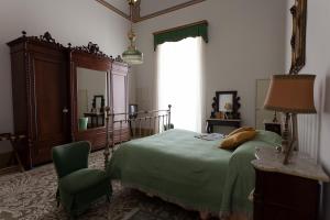 Posteľ alebo postele v izbe v ubytovaní Palazzo Pio Apartment