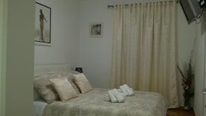 Postel nebo postele na pokoji v ubytování APARTMENT "Patricia"