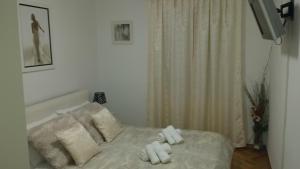 Postel nebo postele na pokoji v ubytování APARTMENT "Patricia"