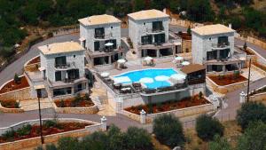 an aerial view of a large house with a swimming pool at Anastasia Village in Nikiana +57 photos