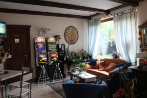 a living room with pinball machines on the wall at Jolly Residence in Bormio