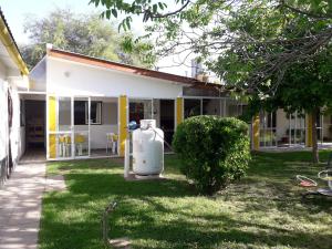 a house with a generator in the yard at La Nona in Villa Cura Brochero