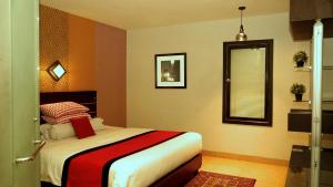 Rúm í herbergi á Citi M Hotel Gambir