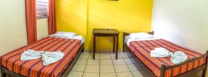 Ліжко або ліжка в номері Berakah B&B- Central Park