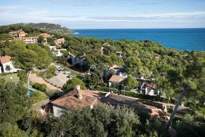 an aerial view of a house and the ocean at Wonderful Apartment with Outstanding Views - Calella de Palfrugell in Calella de Palafrugell