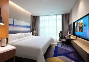Телевизор и/или развлекательный центр в Hampton by Hilton Guangzhou Tianhe Sports Center-Free Shuttle Bus to Exhibition During Canton Fair Period