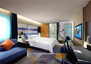 Телевизор и/или развлекательный центр в Hampton by Hilton Guangzhou Tianhe Sports Center-Free Shuttle Bus to Exhibition During Canton Fair Period