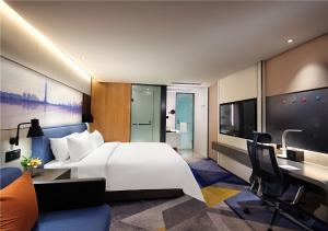 Телевизор и/или развлекательный центр в Hampton by Hilton Guangzhou Tianhe Sports Center-Free Shuttle Bus to Exhibition During Canton Fair Period