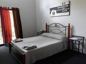 Postel nebo postele na pokoji v ubytování Speewah Country Tavern