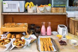 a table topped with lots of different types of food at Hotel Boutique Castilla de Leòn in Cuenca