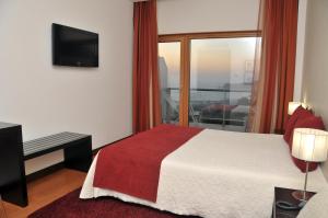 מיטה או מיטות בחדר ב-Hotel Miramar Sul