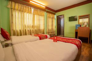 Postel nebo postele na pokoji v ubytování Hotel Green Orchid