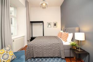 A bed or beds in a room at Tallinn City Apartments - Old Town