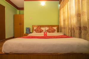 Postel nebo postele na pokoji v ubytování Hotel Green Orchid