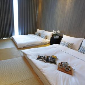 Voodi või voodid majutusasutuse Hotel Day Plus Teascape toas