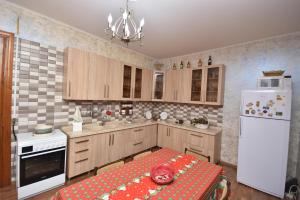 a kitchen with a table with a skull on it at Guest House Green House in Zugdidi