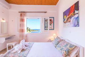 Posteľ alebo postele v izbe v ubytovaní Casa Soula, Gaios Seaview Cottage
