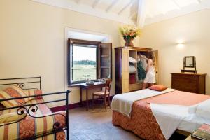 A bed or beds in a room at Poderi Arcangelo