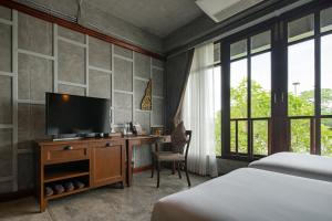 Postel nebo postele na pokoji v ubytování Kasayapi Hotel