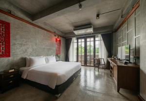 Postel nebo postele na pokoji v ubytování Kasayapi Hotel