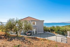 a villa with a view of the ocean at A brand NEW VILLA - Infinity in Podstrana