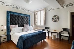 Postel nebo postele na pokoji v ubytování Art Hotel Orologio