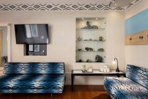 TV a/nebo společenská místnost v ubytování Art Hotel Orologio