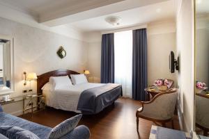 Postel nebo postele na pokoji v ubytování Art Hotel Orologio