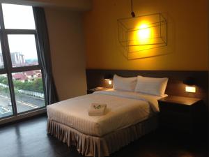 Postel nebo postele na pokoji v ubytování KIP Hotel
