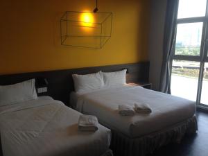 Postel nebo postele na pokoji v ubytování KIP Hotel