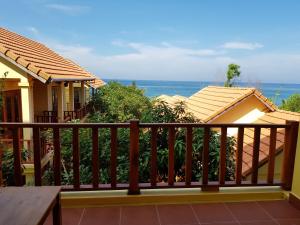 a balcony with a view of the ocean at Free Beach Resort in Phú Quốc