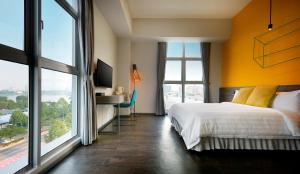 Postel nebo postele na pokoji v ubytování KIP Hotel
