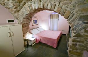 Postel nebo postele na pokoji v ubytování I Valloni Apartments