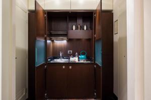 Kuchyň nebo kuchyňský kout v ubytování Art Hotel Orologio
