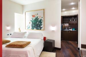 Postel nebo postele na pokoji v ubytování Art Hotel Orologio