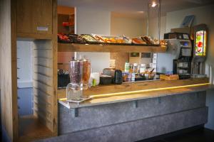 Kuchyň nebo kuchyňský kout v ubytování Hotel Ibis Budget Vichy