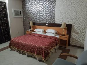 Rúm í herbergi á Citilodge Hotel