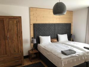 Postel nebo postele na pokoji v ubytování Tauernhaus Appartment