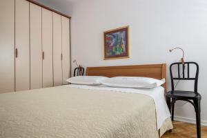 Postel nebo postele na pokoji v ubytování Apartment Mirela
