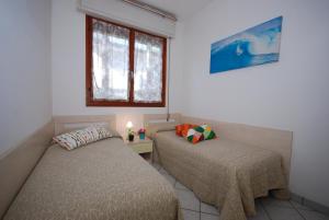 Ένα ή περισσότερα κρεβάτια σε δωμάτιο στο Villa Usignolo